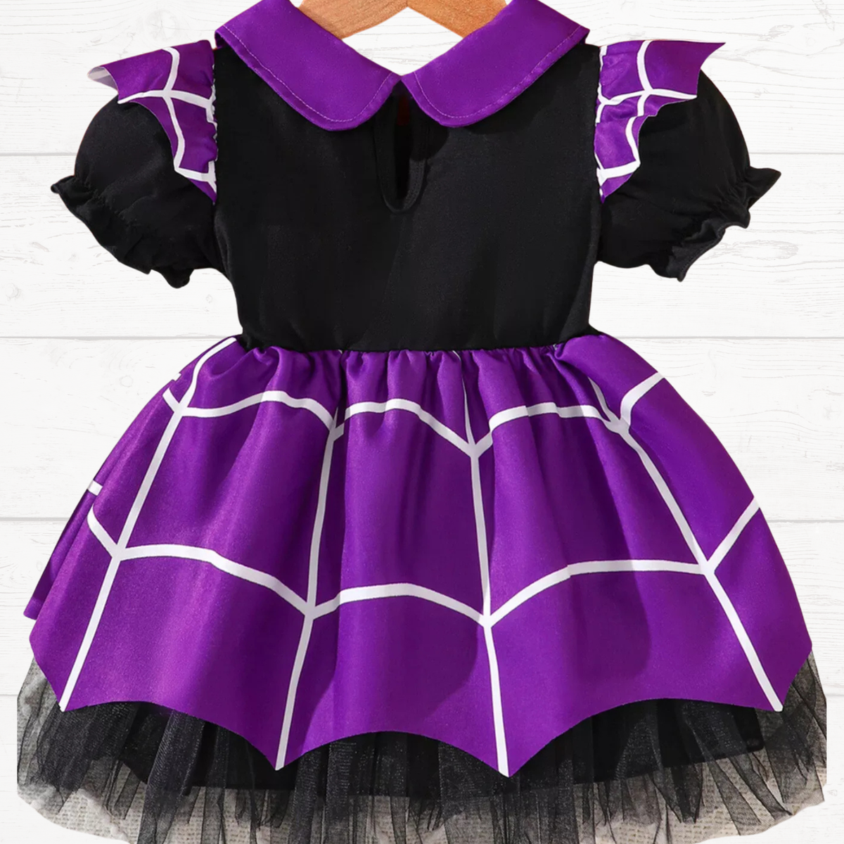Purple and black spiderweb Halloween dress with puff sleeves and flared tulle skirt