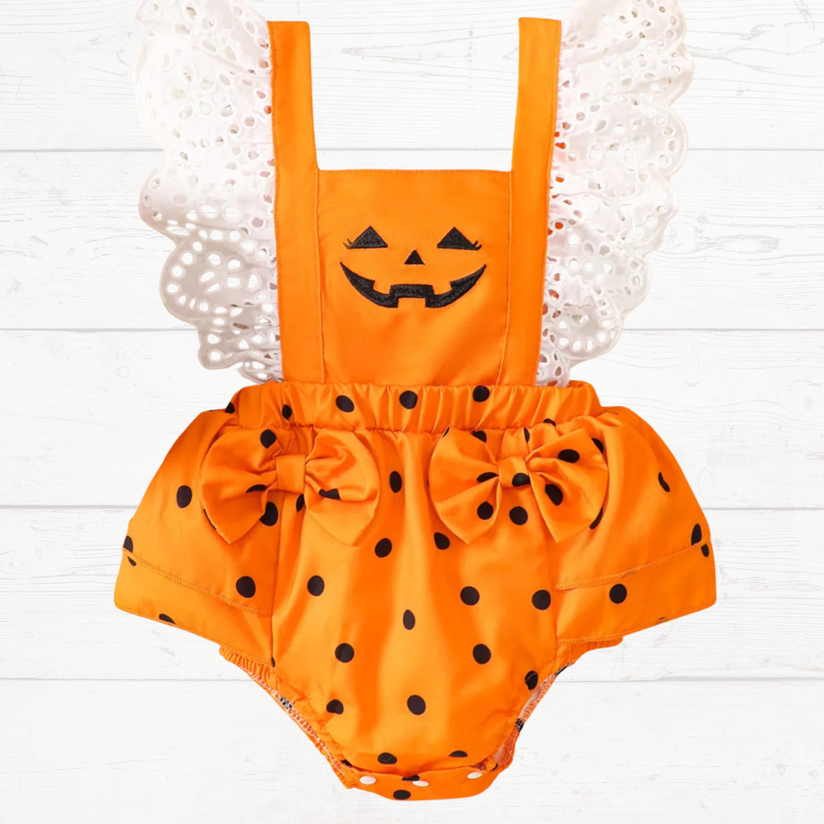 Kids Halloween bodysuit: orange black polka dot romper with pumpkin face front