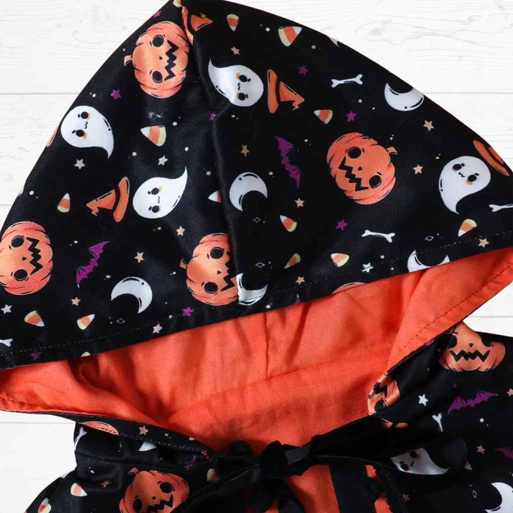 Black hooded cape with orange lining and Halloween ghost, jack-o-lantern and bat prints