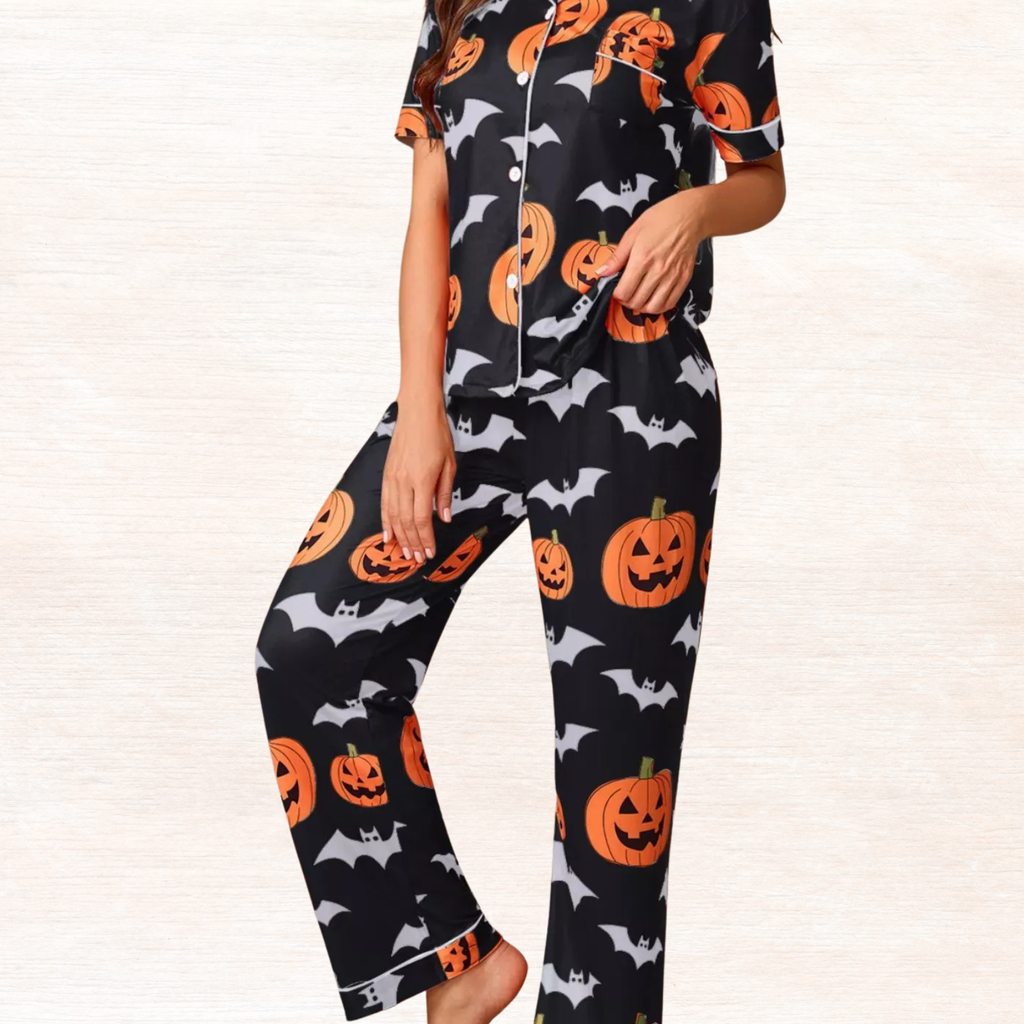 Black Halloween pajama set with short-sleeve button top and lounge pants, pumpkin/bat print