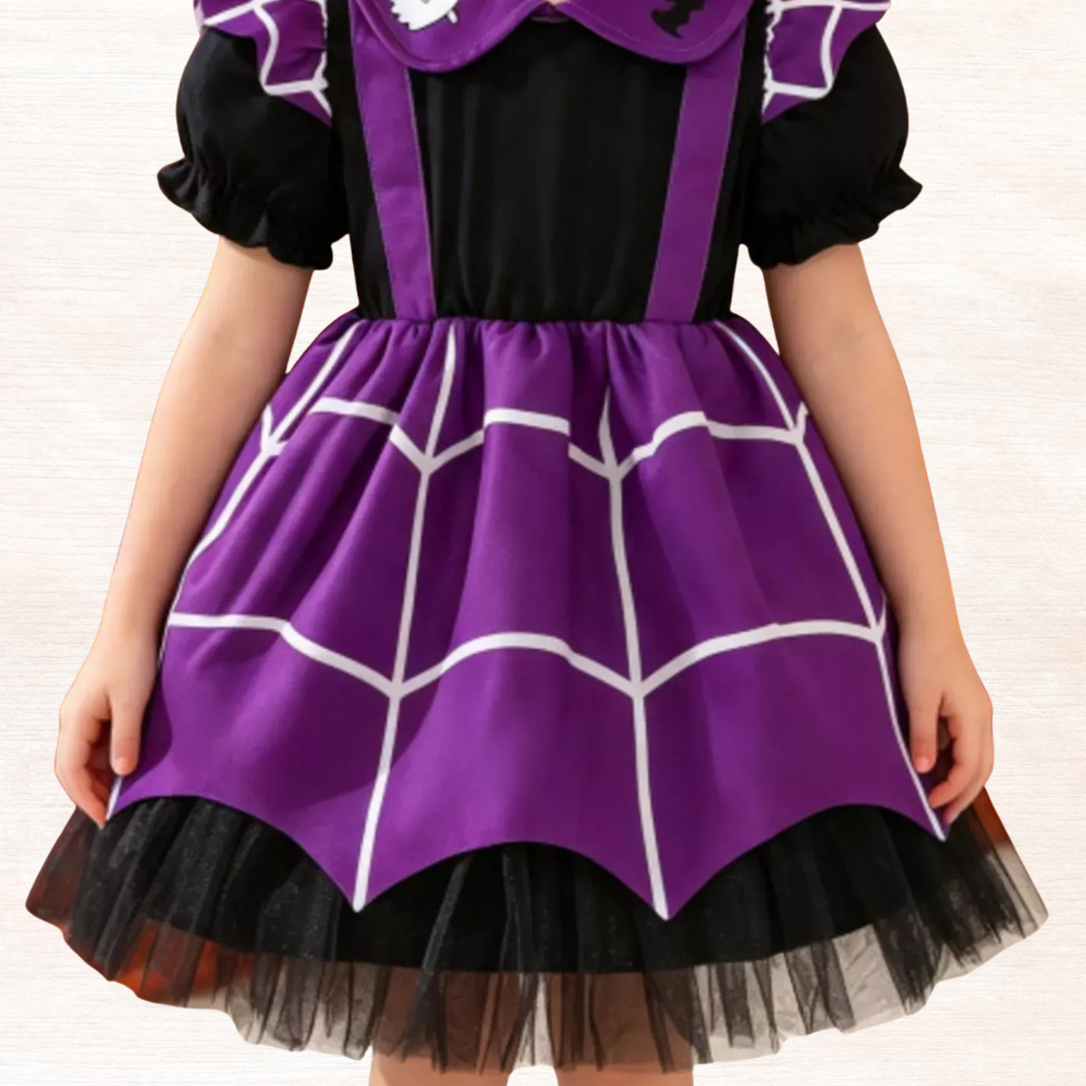 Purple spiderweb dress with black puff sleeves and gathered tulle hem