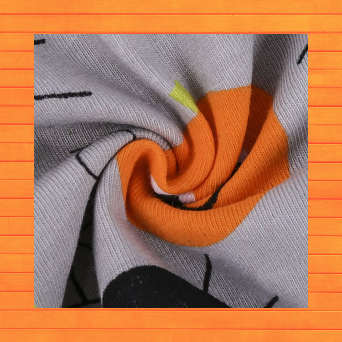 Gray long-sleeve romper with orange ribbed cuff and Halloween character print