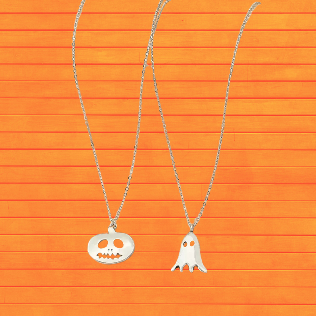 Two-piece Halloween pendant necklace set with silver chains, jack-o-lantern and ghost charms.