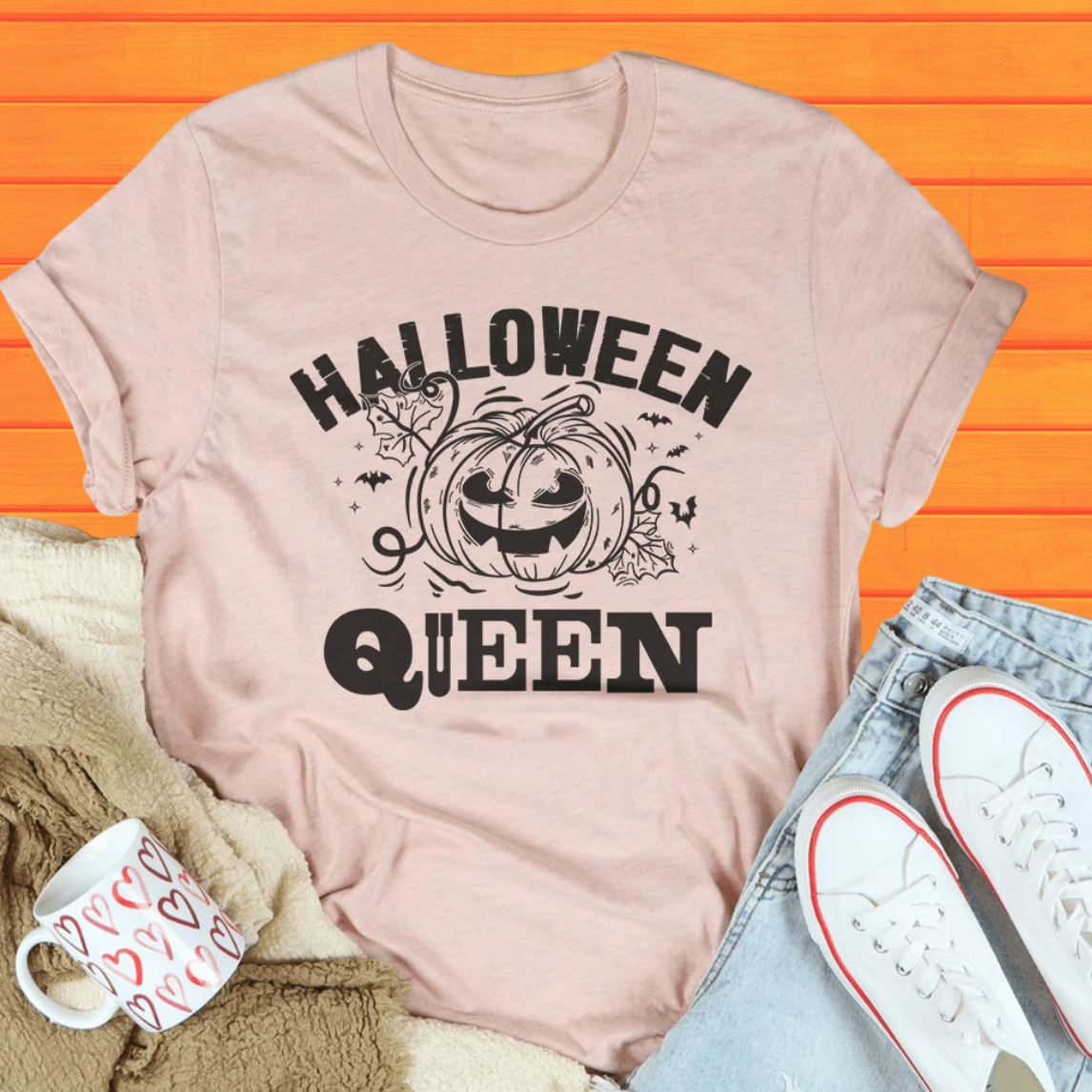 Light pink short-sleeve Halloween Queen graphic tee with jack-o-lantern illustration