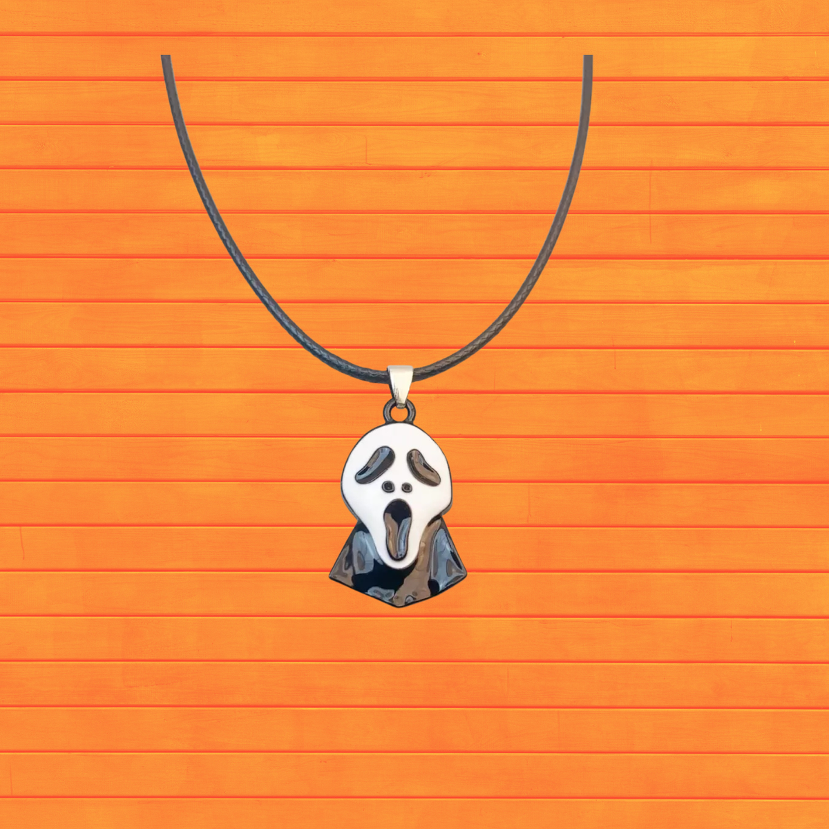 Halloween ghost pendant necklace with gray cord and white ghost face charm