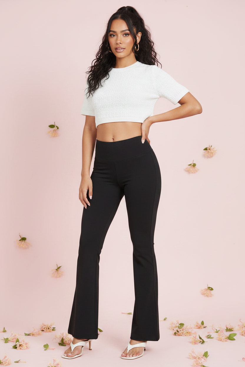 Black flare yoga pants with raw edge hem and wide leg opening