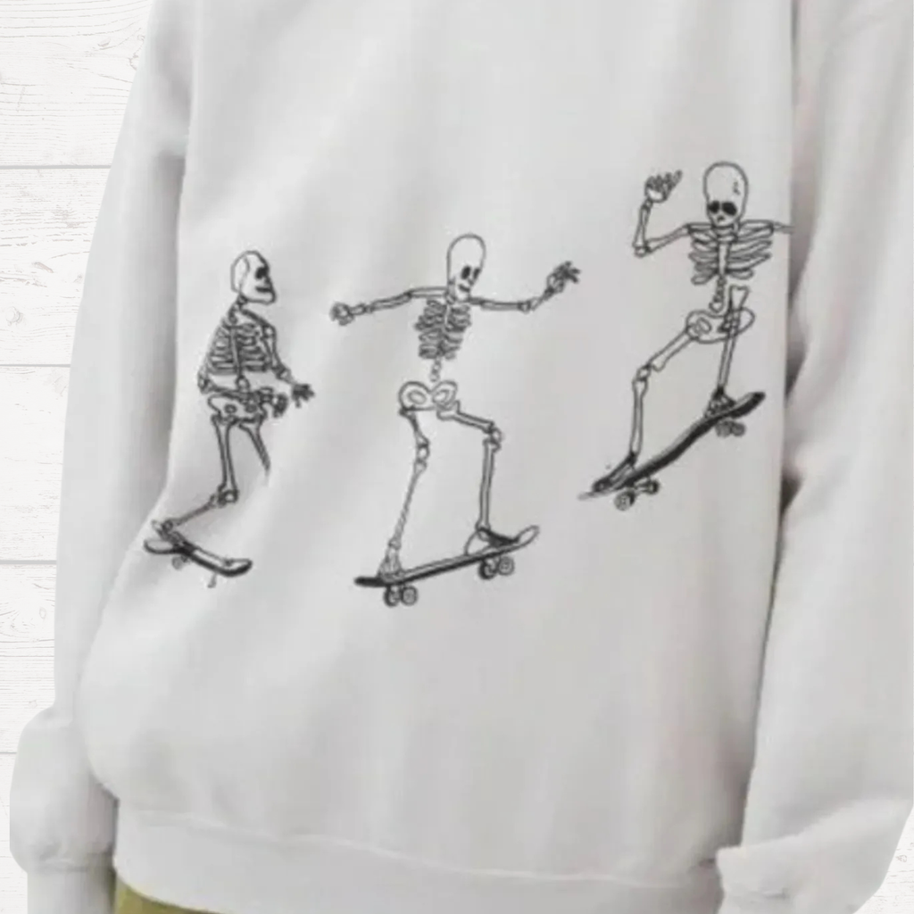Light gray oversized sweatshirt with white skeleton skateboard graphic on front