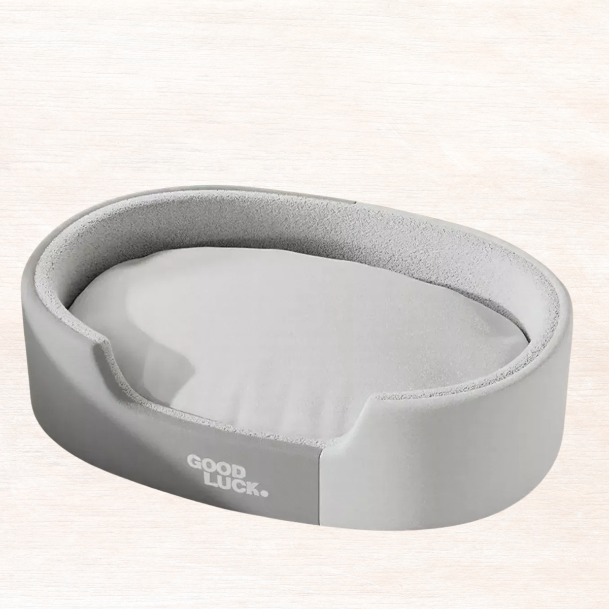 Oval plush pet nest with gray outer and light gray inner lining