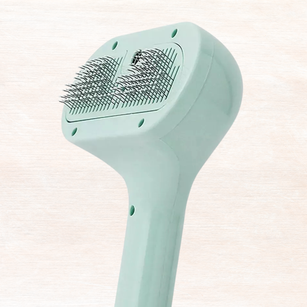 Mint pet hair remover comb head with dense textured bristle rows.