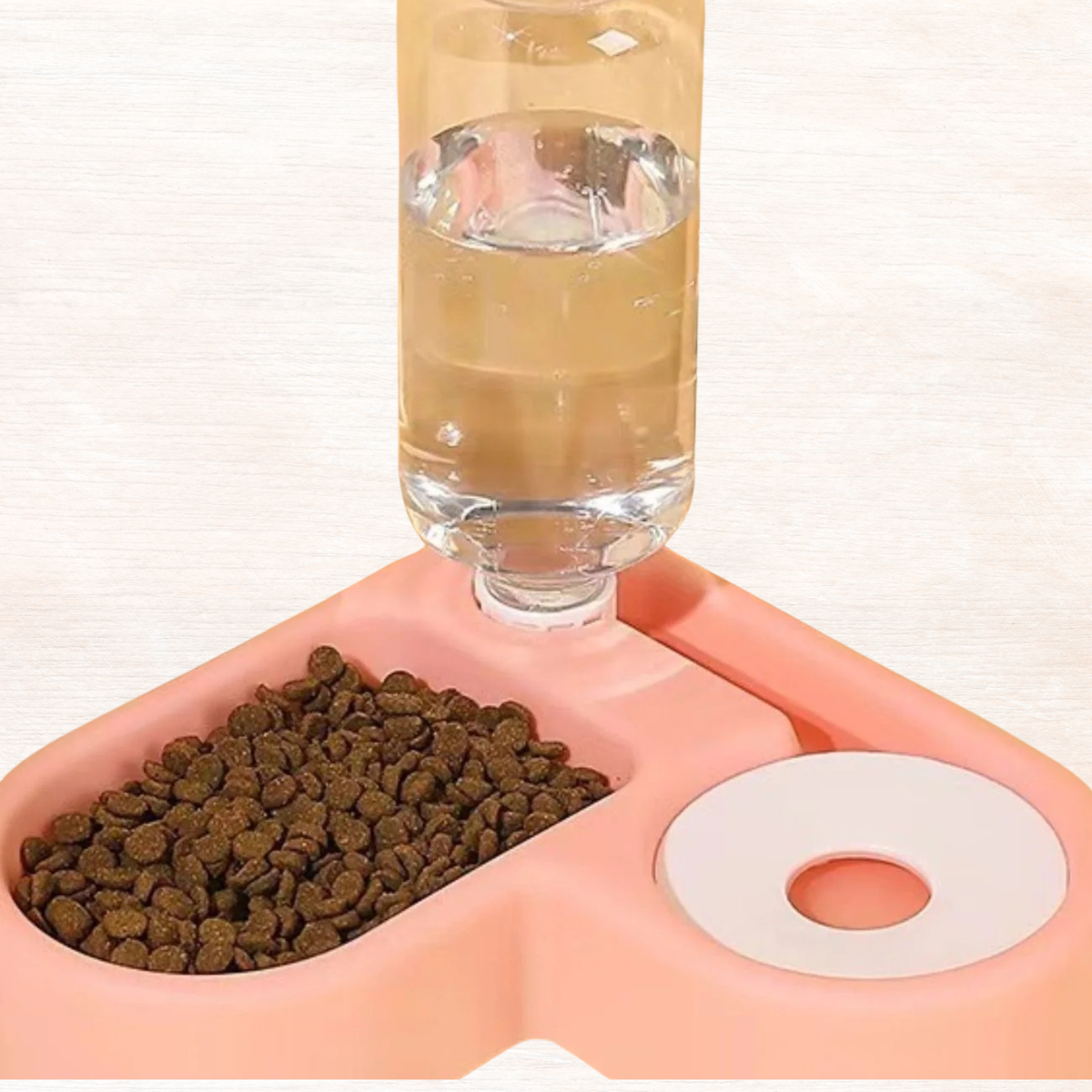 Blush pink automatic water refilling pet bowl with clear water bottle and food dish