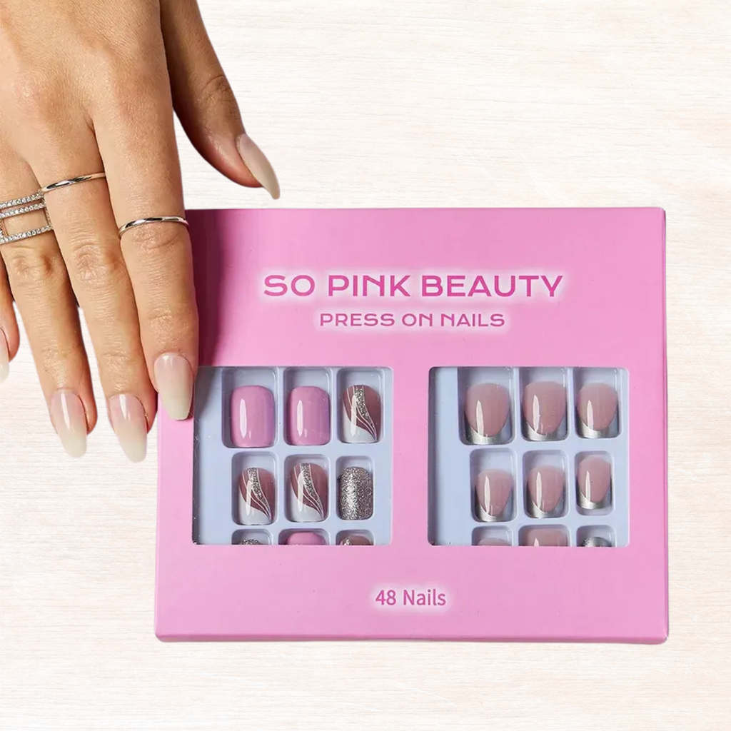 Pressed nail sets in pink box, nude and silver styles, shown with nails on hand