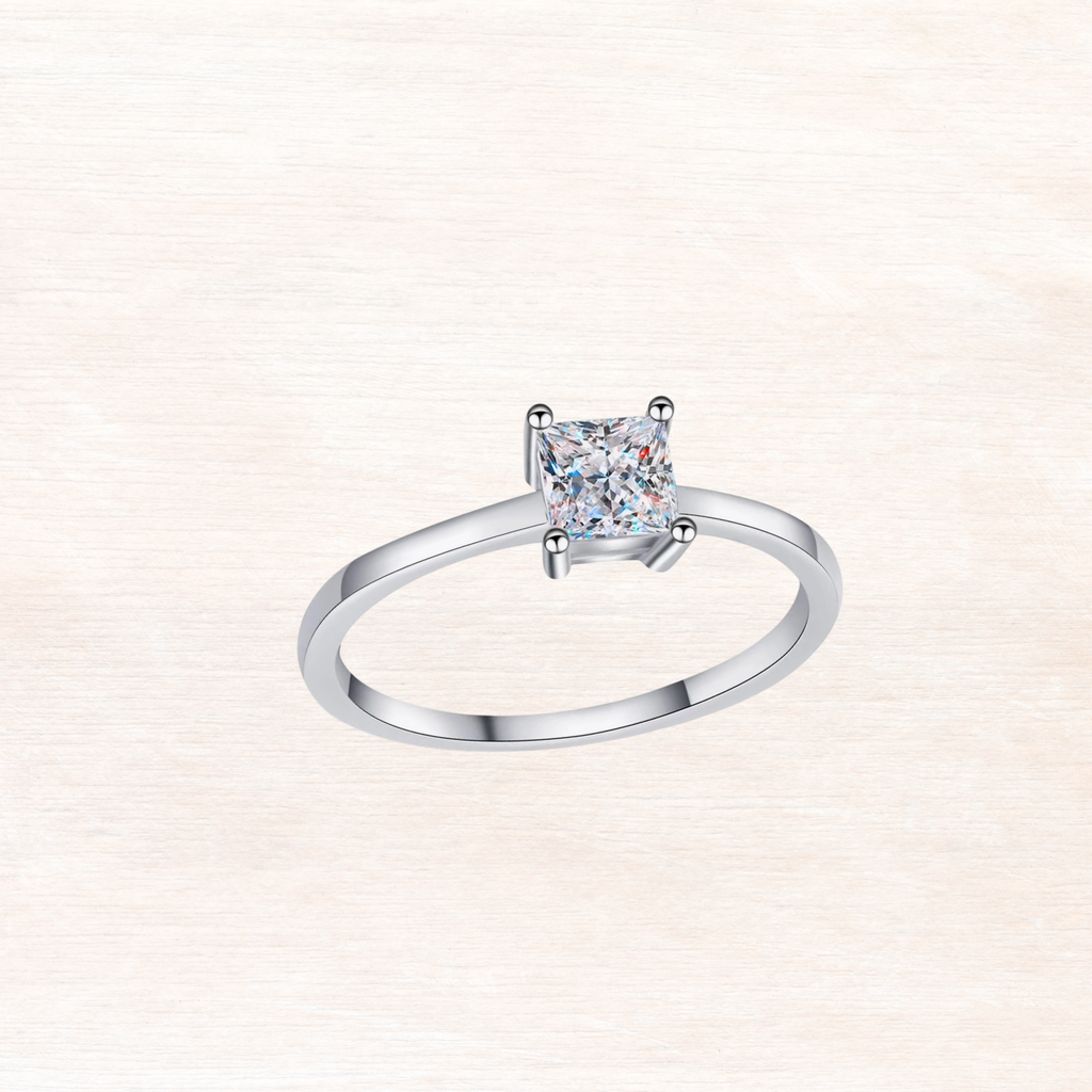 Sterling silver ring with princess-cut moissanite center stone and four prongs