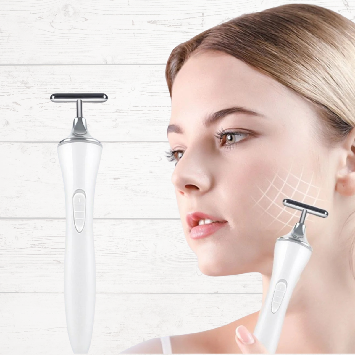 White microcurrent facial massager with T-shaped electrodes, held to face