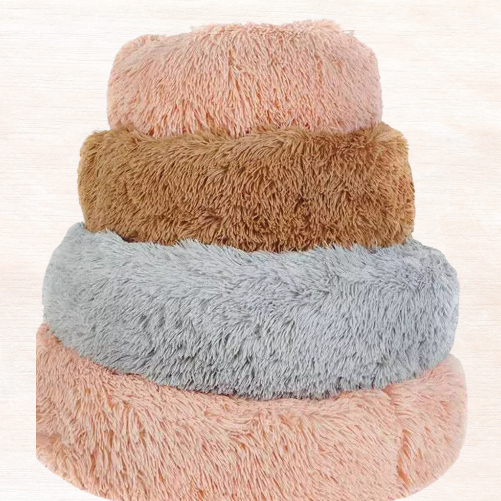 Fluffy plush donut pet nest with layered plush rings in peach, tan, and light gray