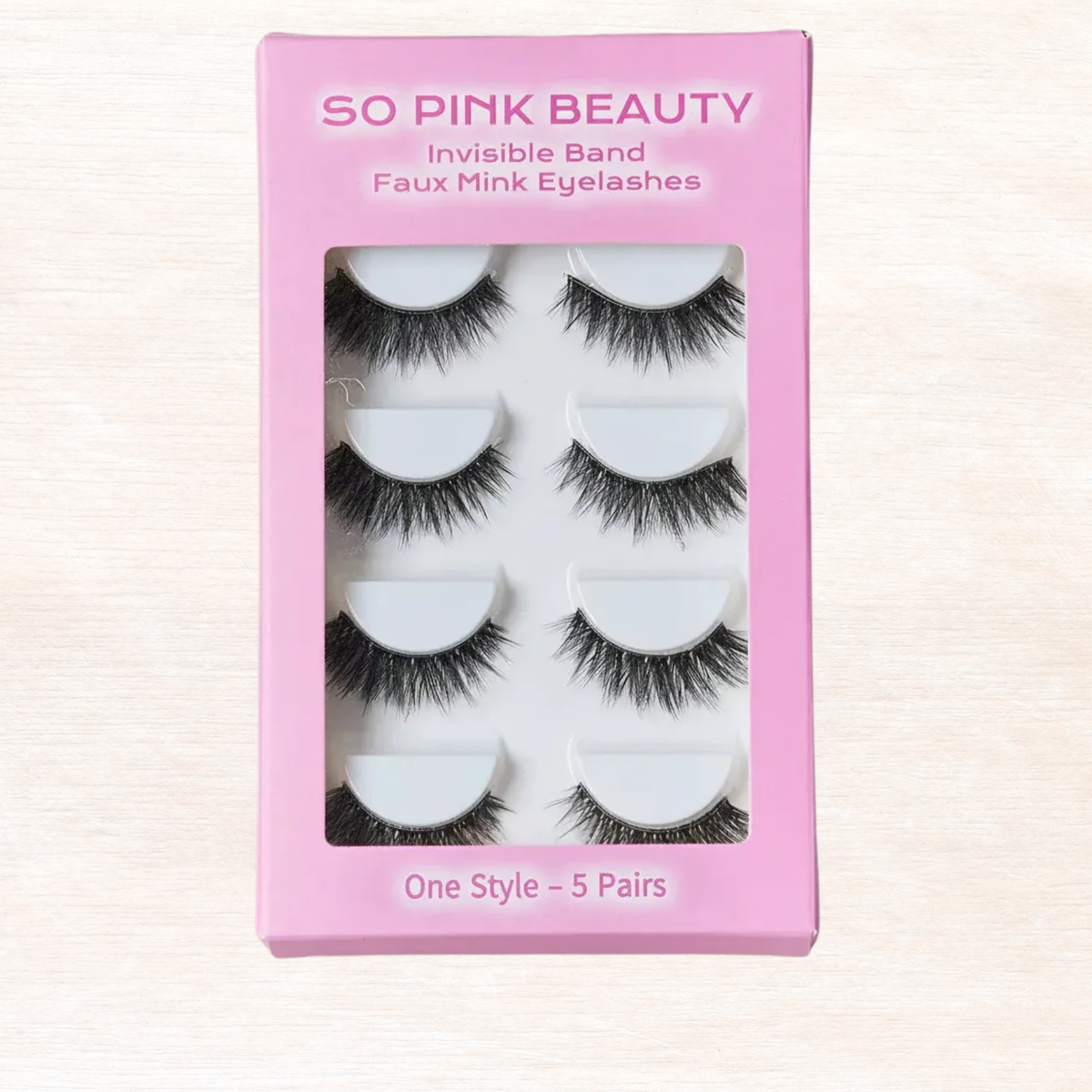 SO PINK BEAUTY faux mink eyelashes box, invisible band lashes, five pairs in window