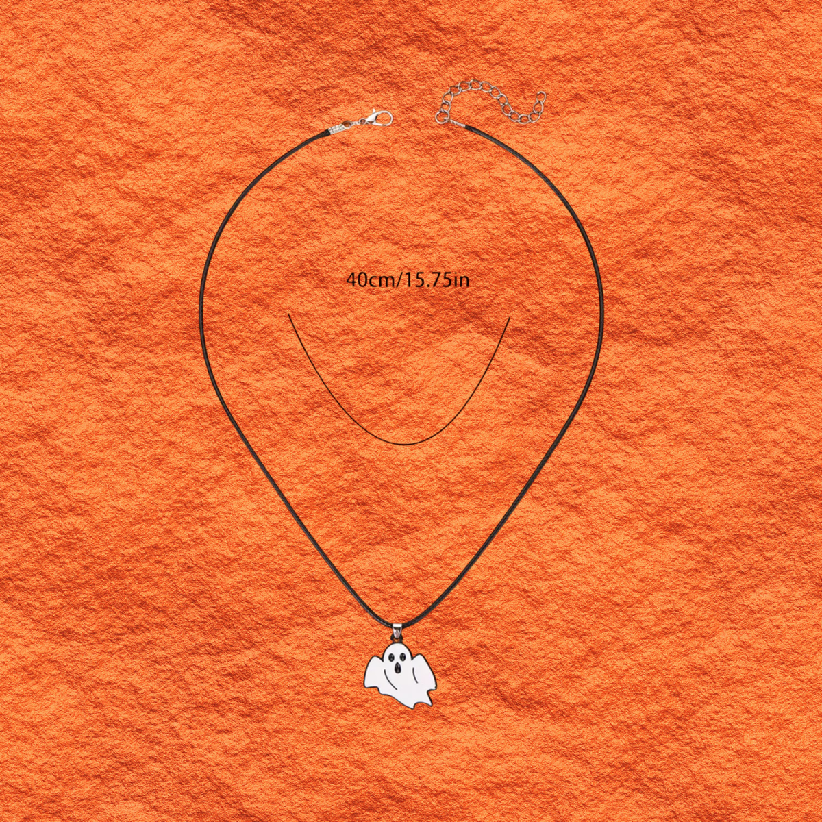 Halloween ghost charm necklace with thin black cord and small white ghost pendant