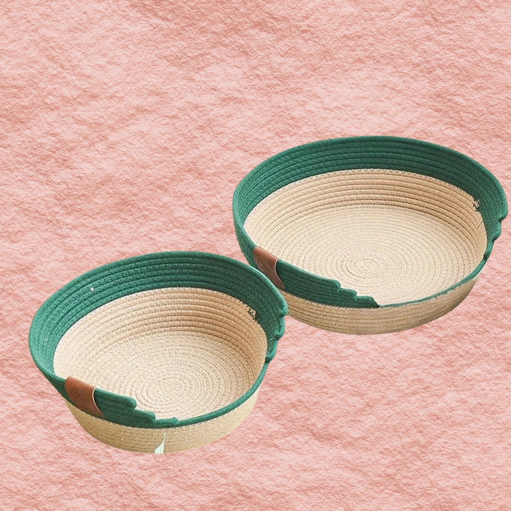 Woven pet nest set with dark green rims and cream woven interiors, two sizes shown.