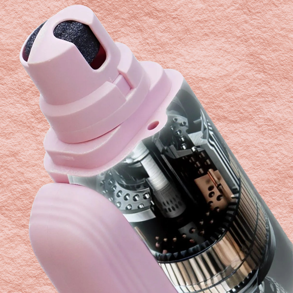 Electric pet nail grinder detail, blush pink housing with exposed metal grinding cylinder