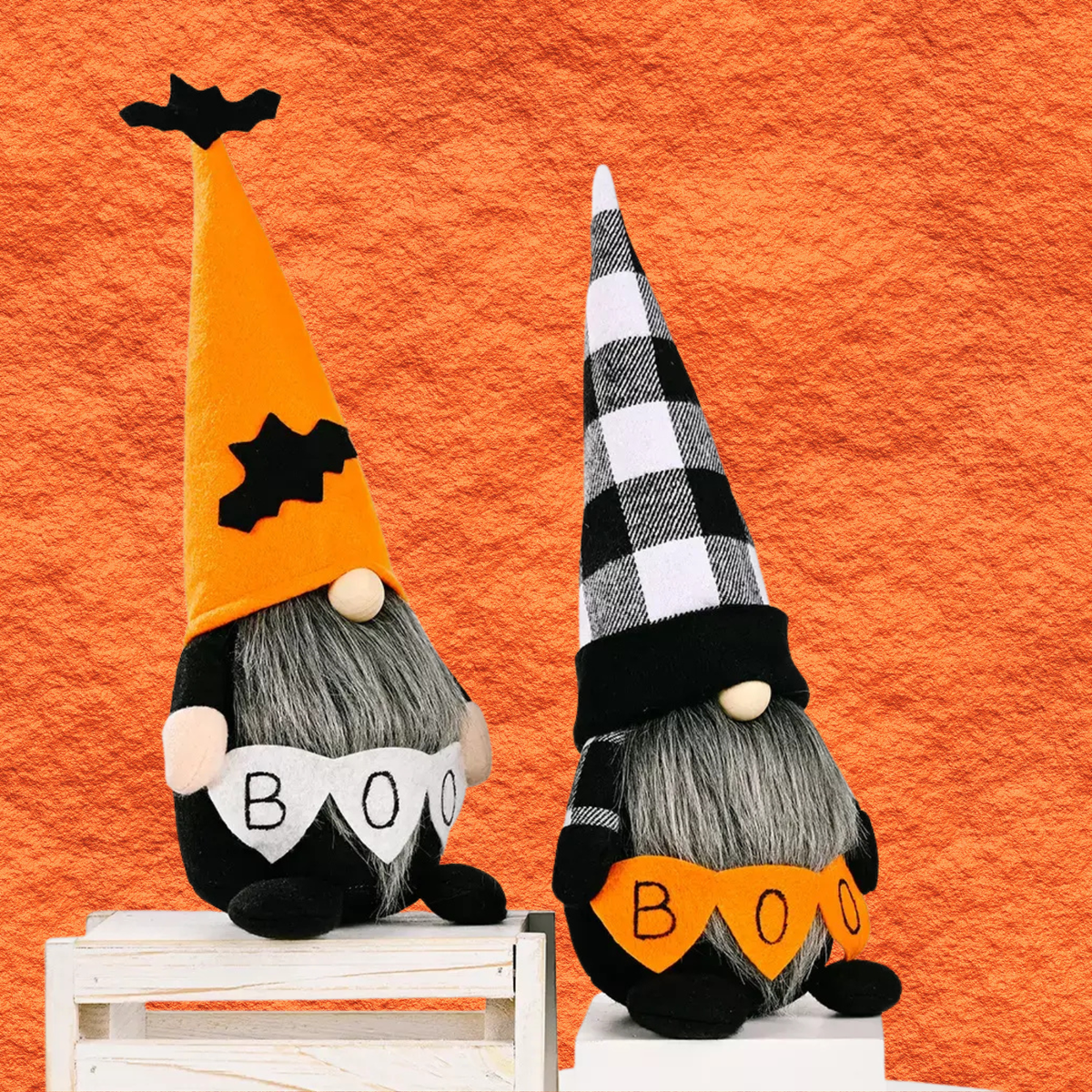 Halloween gnome decorations on blocks: left orange hat, right plaid hat, black outfits with BOO