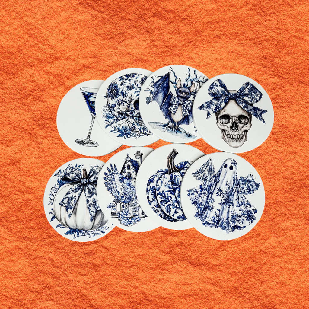 Round blue-and-white Halloween coasters set, featuring bat, skull, bow, and pumpkin designs.