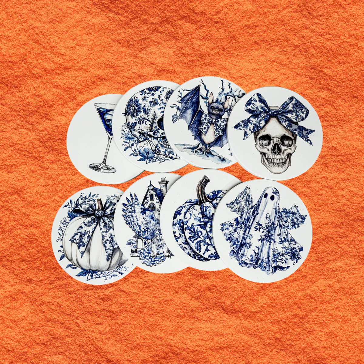 Round blue-and-white Halloween coasters set, featuring bat, skull, bow, and pumpkin designs.