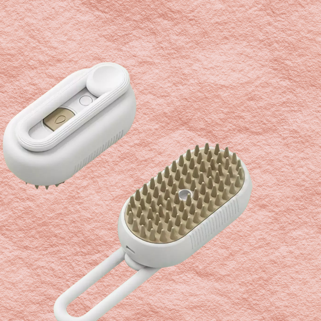White electric pet massage brush with light tan bristles and built-in power controls