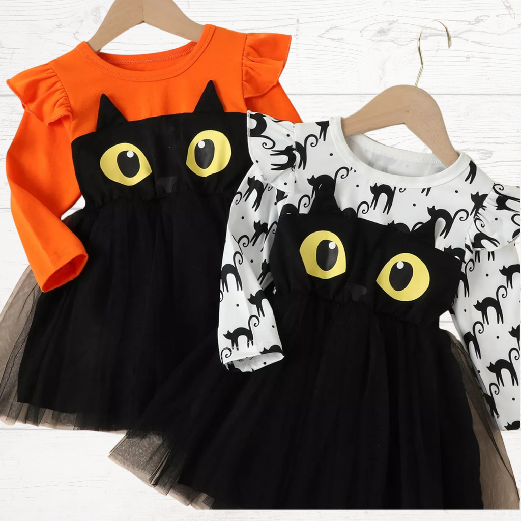 White cat-print long-sleeve dress with black tulle skirt and yellow eye appliques