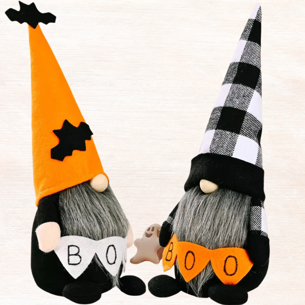 Halloween gnome decorations close up: orange-hat gnome and plaid-hat gnome with BOO on bib
