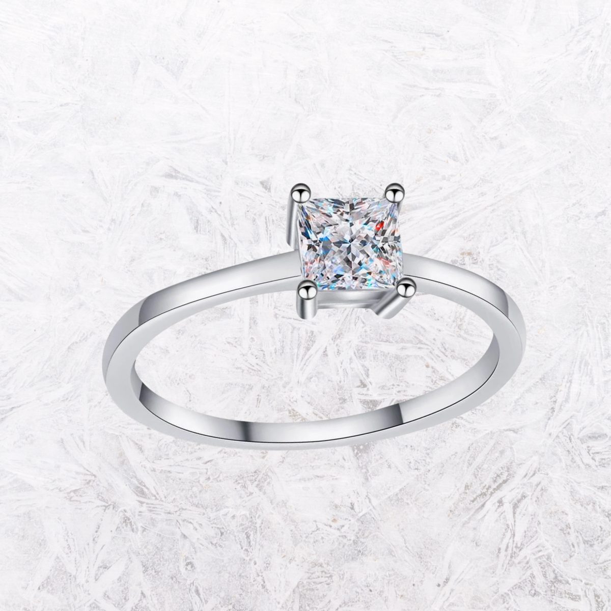 Sterling silver solitaire ring showing princess-cut moissanite in four-prong setting