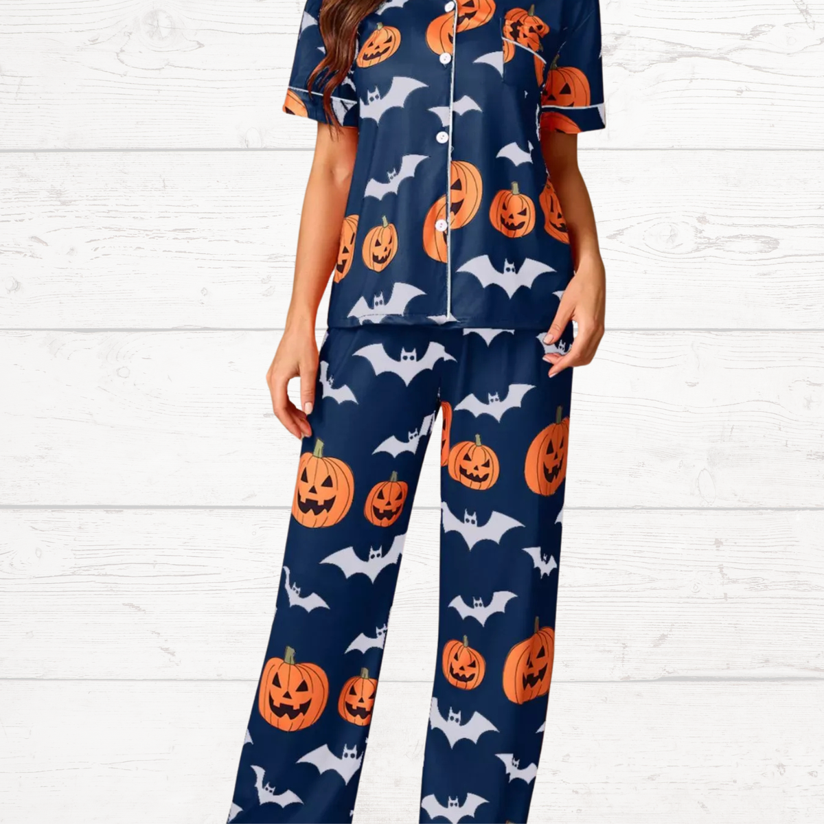 Navy Halloween pajama set, short-sleeve button top and matching lounge pants with pumpkin/bat