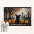 Halloween doormat close-up with Affenpinscher in cemetery beside jack-o'-lanterns