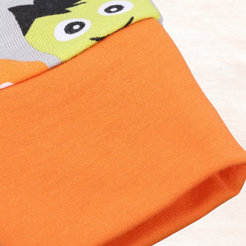 Orange ribbed cuffs on the Halloween pajama leg