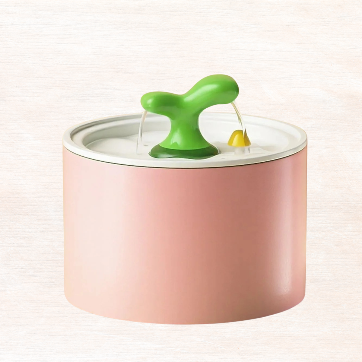 Watermelon pink automatic pet fountain with central spout and yellow drip outlet
