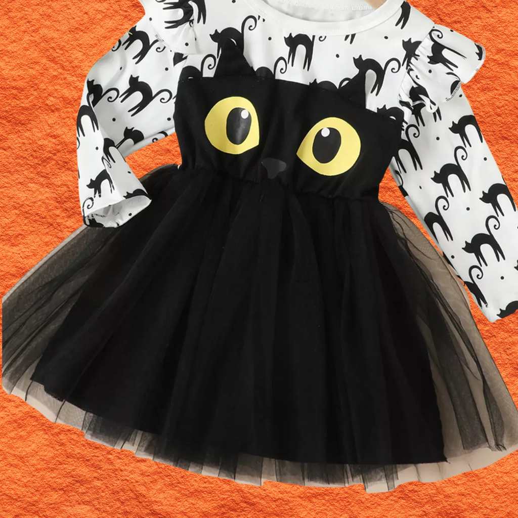 White cat-print dress with black tulle skirt and yellow cat eye applique