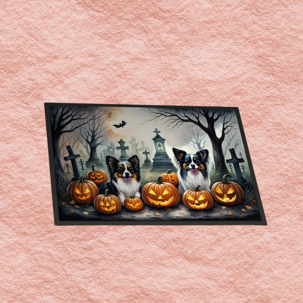 Spooky Halloween doormat with dogs, carved jack-o'-lanterns, and cemetery crosses