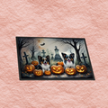 Spooky Halloween doormat with dogs, carved jack-o'-lanterns, and cemetery crosses