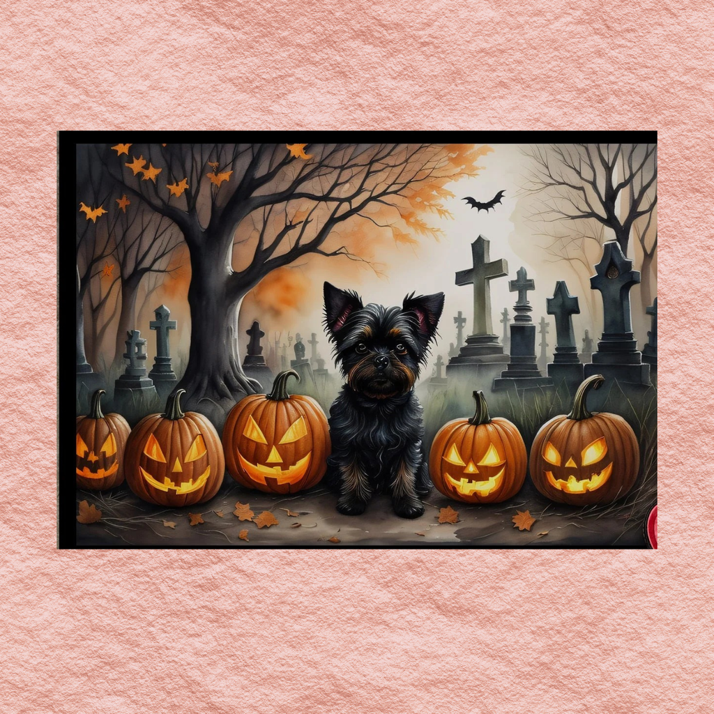 Halloween doormat with Affenpinscher between jack-o'-lantern pumpkins and cemetery crosses