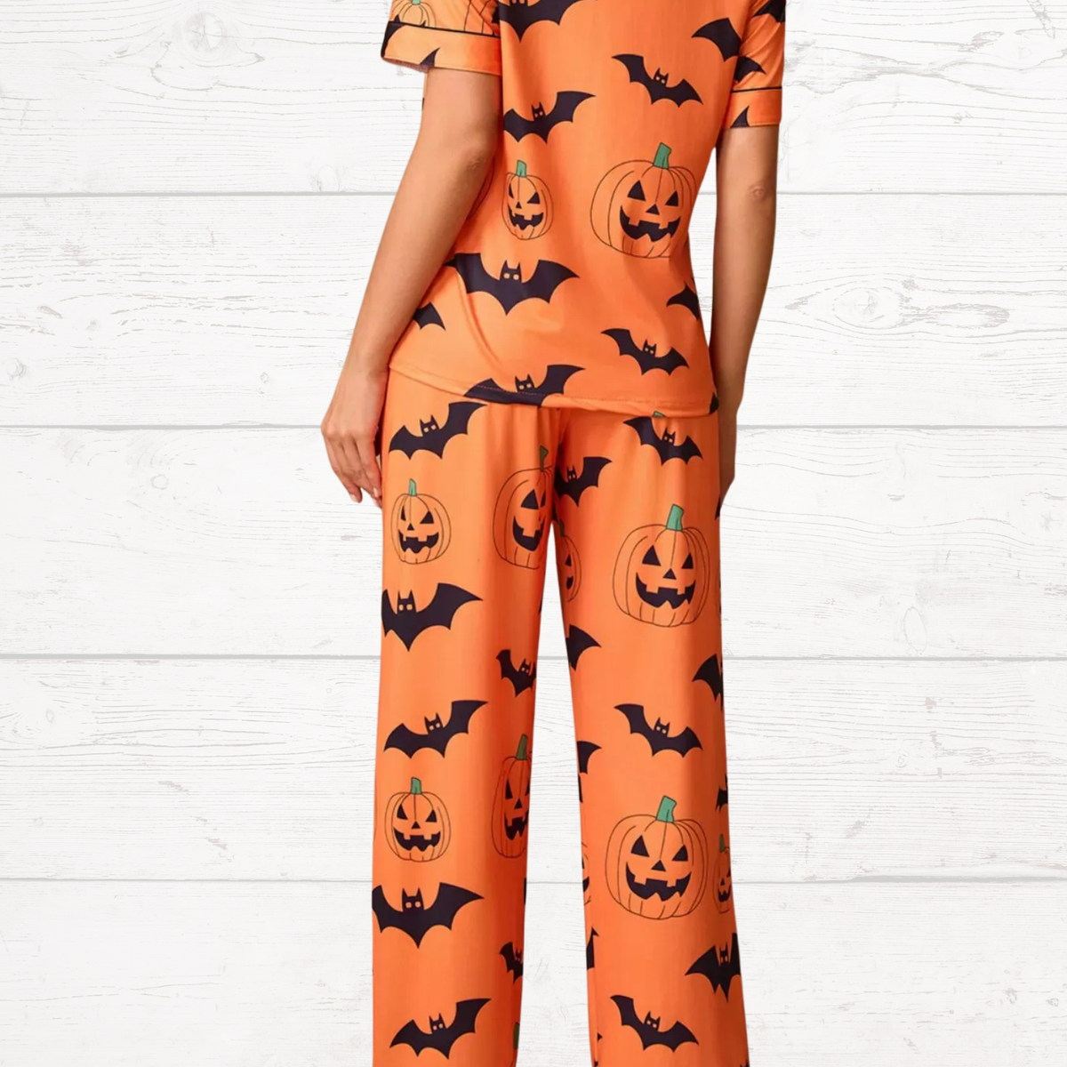 Orange Halloween pajama set, short-sleeve button top and matching lounge pants with pumpkin/bat