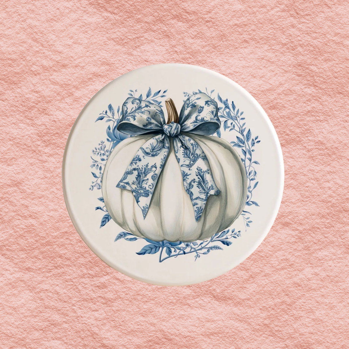 Round blue-and-white Halloween coaster with a bow pumpkin illustration and floral wreath border.
