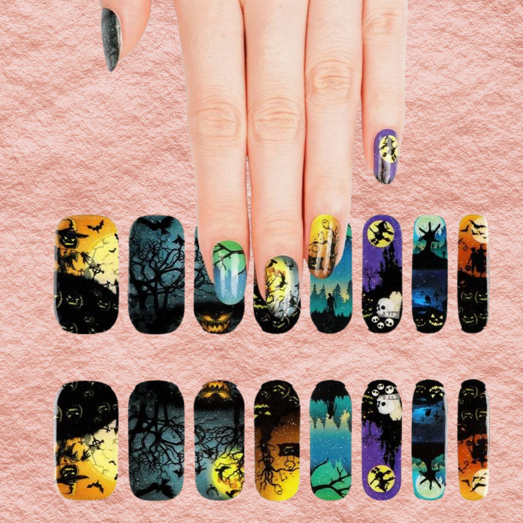 Halloween nail set sheet with two rows of patterned nail tips on peach background