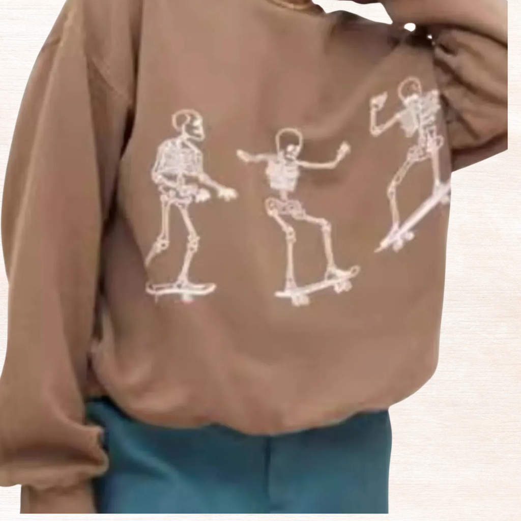 Taupe oversized sweatshirt with white skeleton skateboard graphic across chest