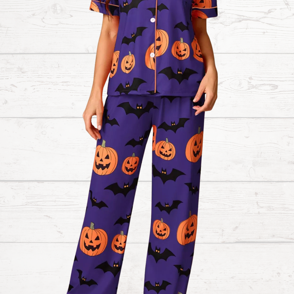 Purple Halloween pajama set with short-sleeve button top and matching lounge pants, pumpkin/bat
