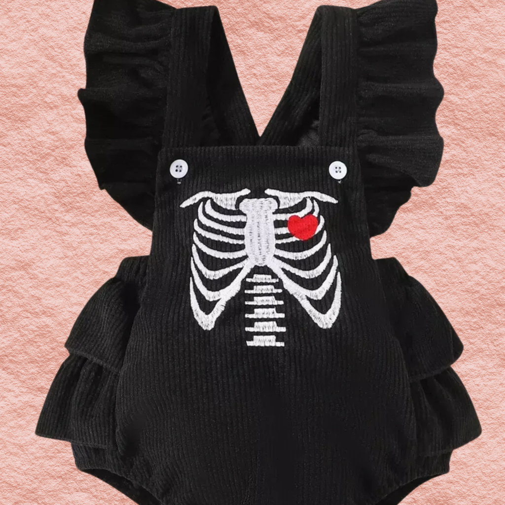 Black ruffle bodysuit with skeleton print and red heart, snap buttons; bow headband