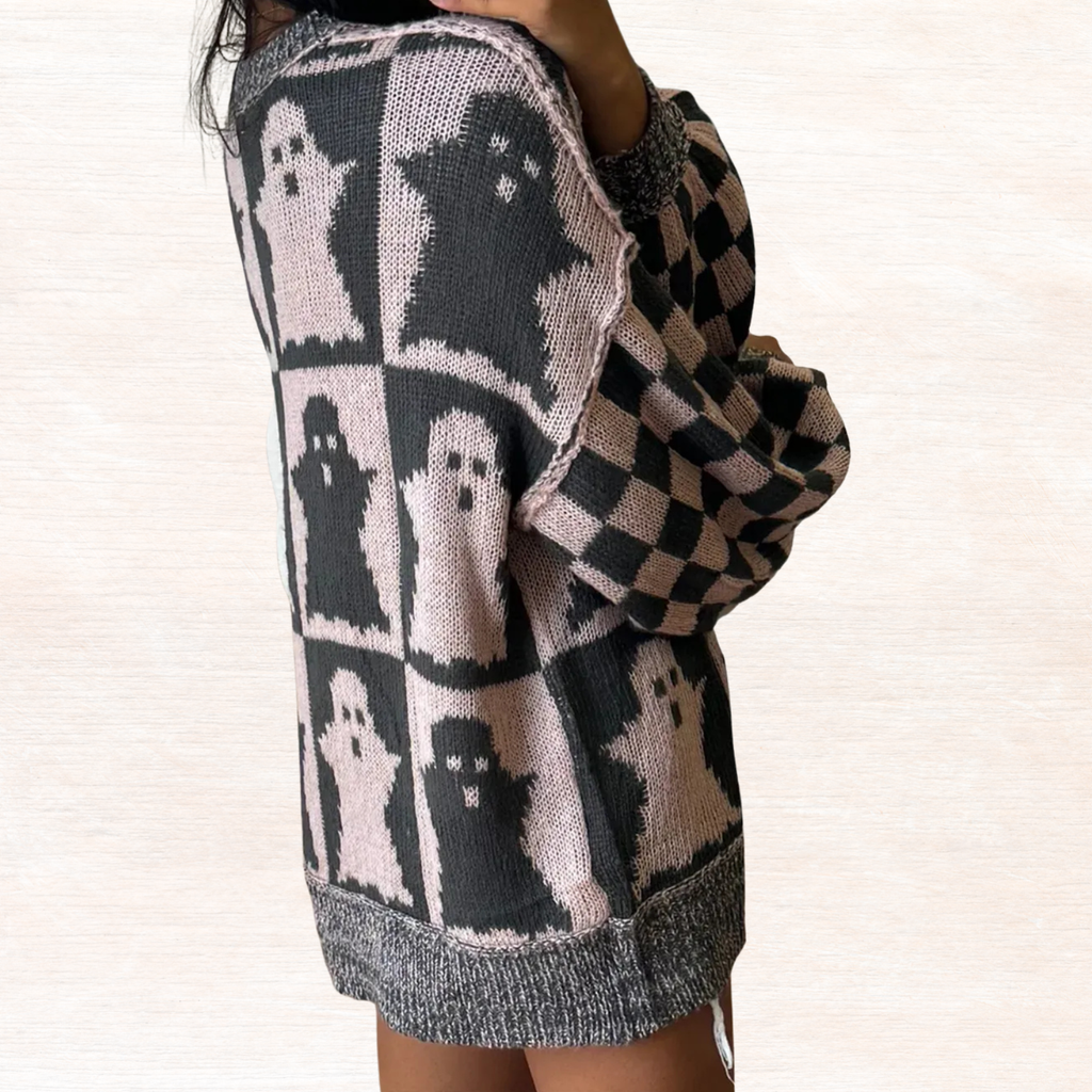 Black and dusty pink ghost knit sweater with checker sleeves and ribbed hem