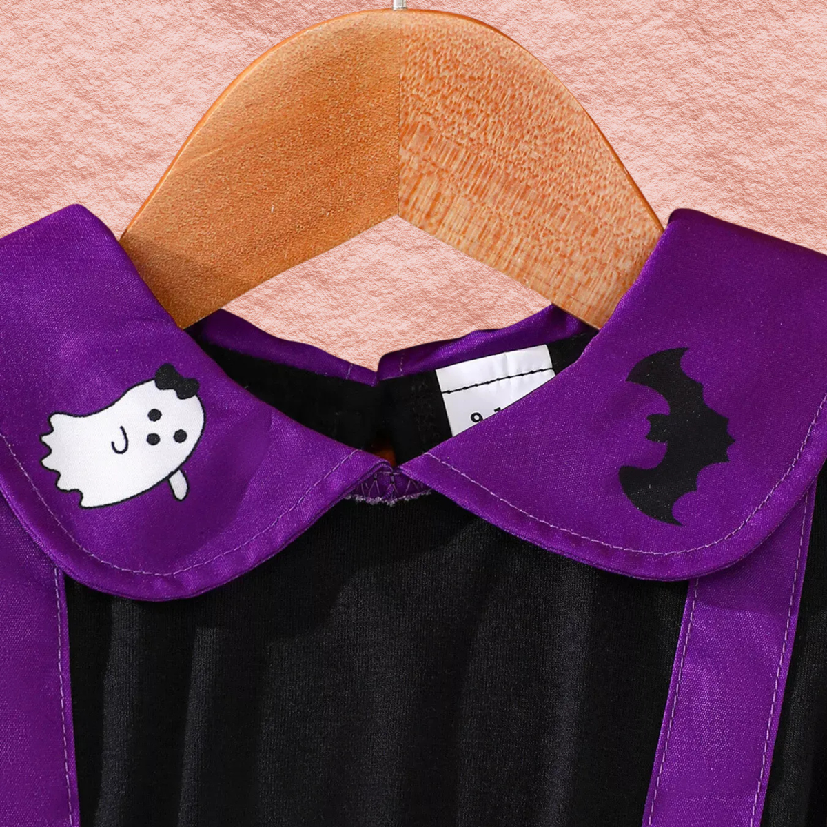 Purple spiderweb print dress with black Peter Pan collar and spider accents