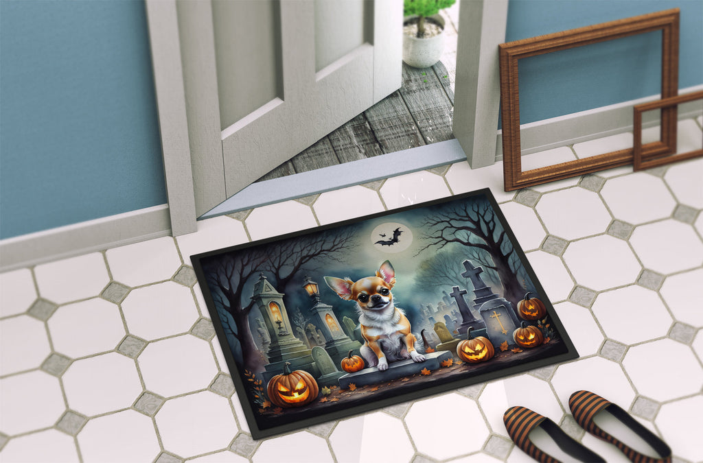 Halloween doormat on entryway floor with chihuahua graveyard artwork and jack-o'-lanterns