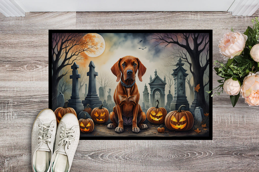 Halloween doormat featuring brown Vizsla, jack-o-lanterns, and haunted cemetery buildings