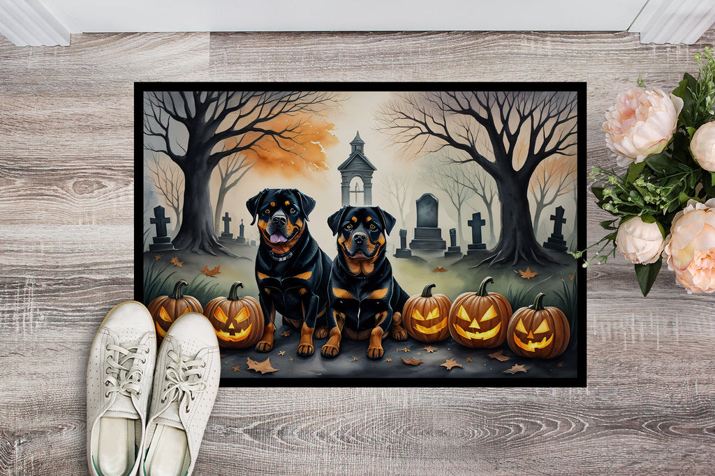 Halloween rottweiler doormat laid on floor, two rottweilers, jack-o-lanterns, graveyard art