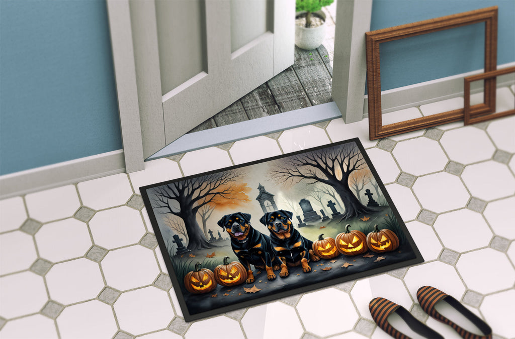 Halloween rottweiler doormat on tile floor, two rottweilers, pumpkins, and tombstones