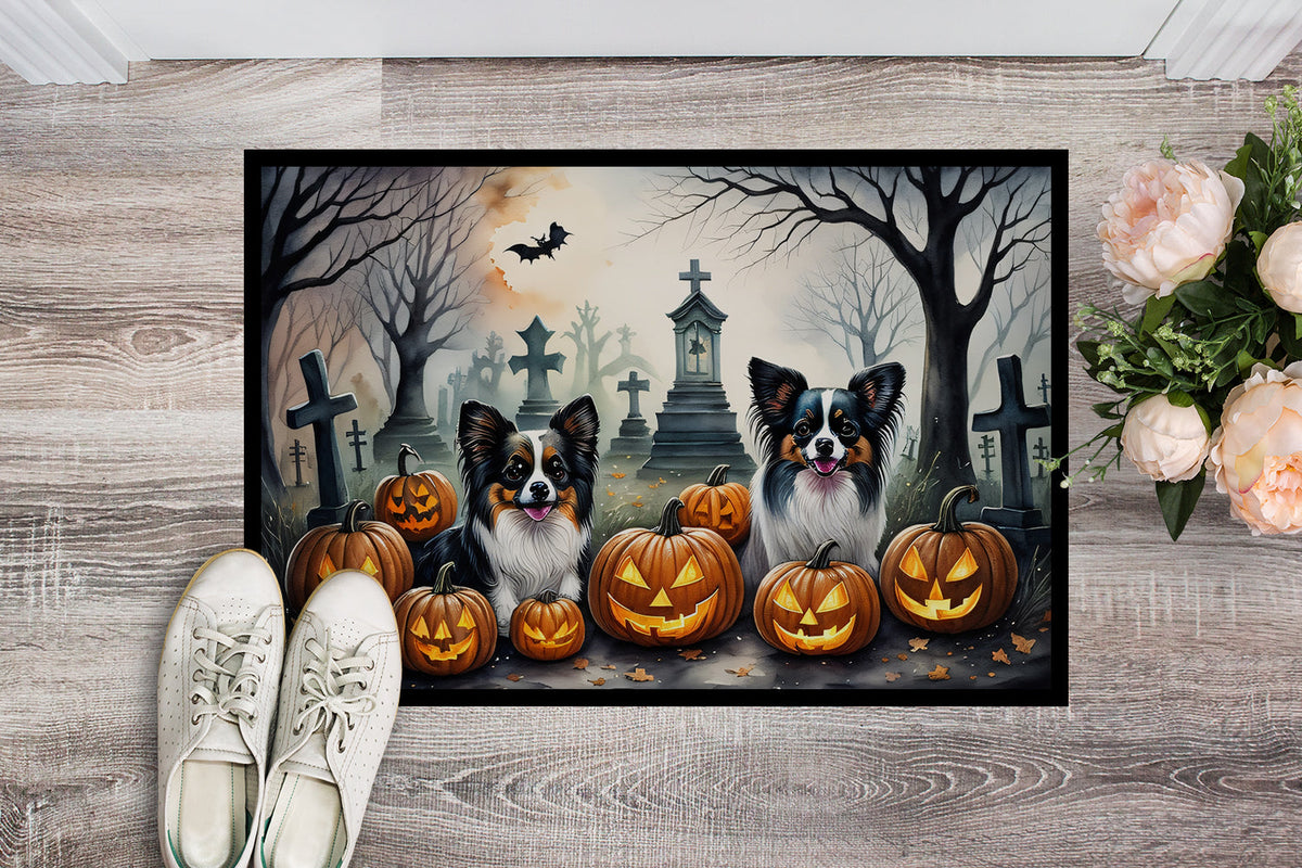 Spooky Halloween doormat featuring two dogs among jack-o'-lanterns and tombstones